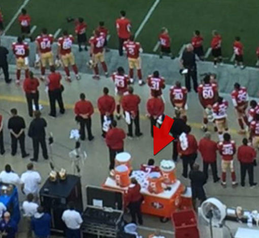 Image result for pictures of colin kaepernick sitting during the national anthem