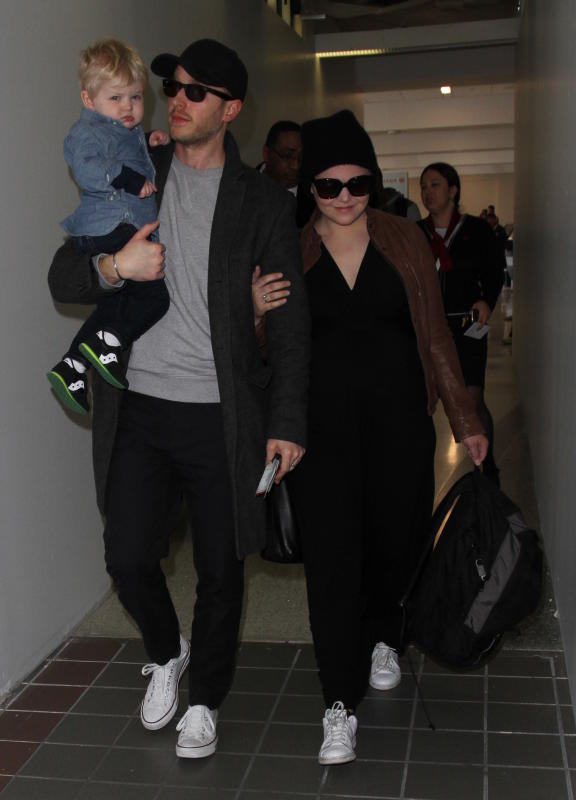 Ginnifer goodwin and josh dallas land at lax with their son